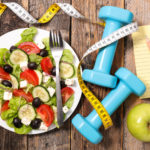 healthy lunch with tape measure and dumbells